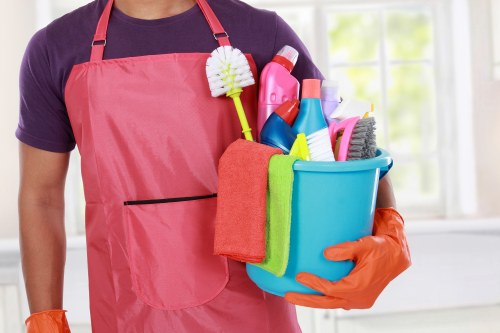 Cleaning technician checking tools and workspace hazards